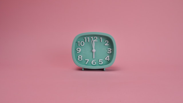 Aqua clock with pink background